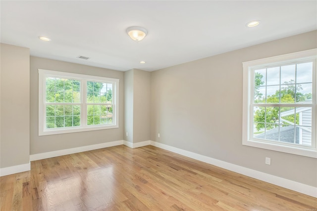 unfurnished room with light hardwood / wood-style flooring