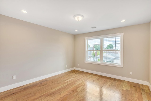 unfurnished room featuring light wood-type flooring