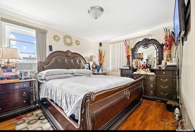 bedroom featuring dark hardwood / wood-style flooring