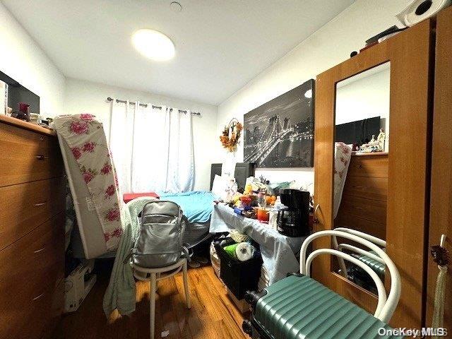 bedroom with hardwood / wood-style flooring