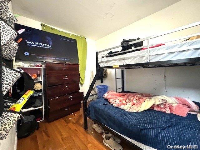 bedroom featuring dark hardwood / wood-style flooring