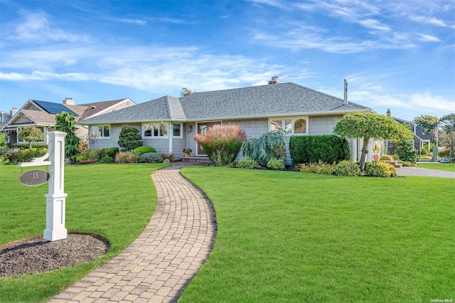 ranch-style home with a front yard