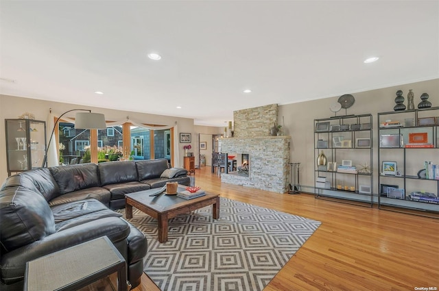 living room with a fireplace and hardwood / wood-style flooring