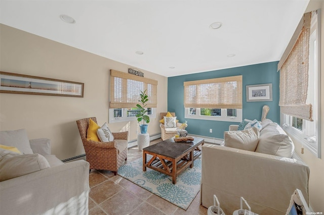 tiled living room with a baseboard radiator and a wealth of natural light