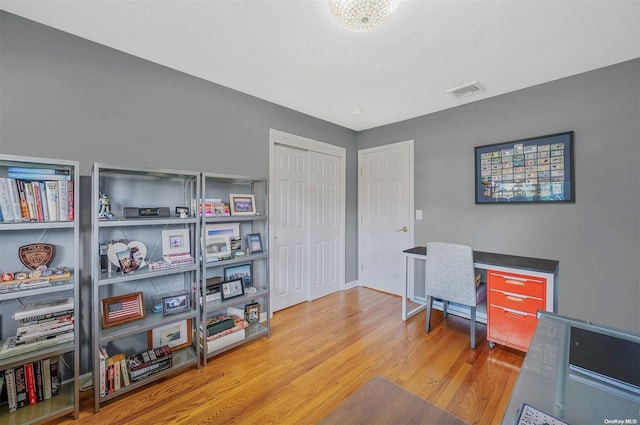 office space with light hardwood / wood-style flooring