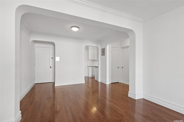 unfurnished room with electric panel, dark wood-type flooring, and ornamental molding