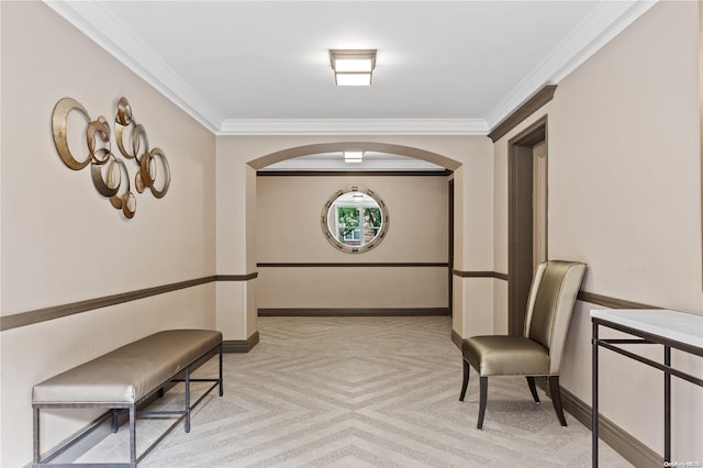 hall with light carpet and crown molding