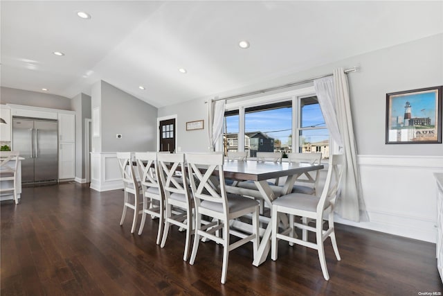 dining space featuring dark hardwood / wood-style floors and lofted ceiling