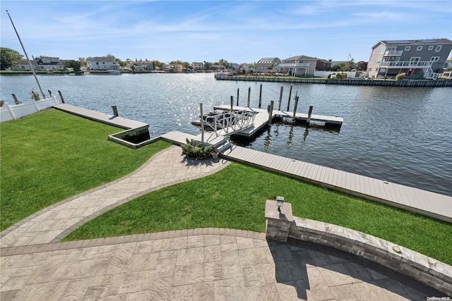 dock area featuring a water view and a yard