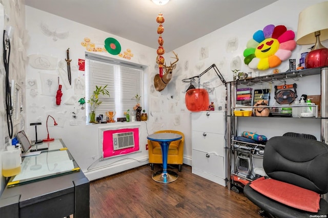 playroom with dark wood-type flooring and heating unit