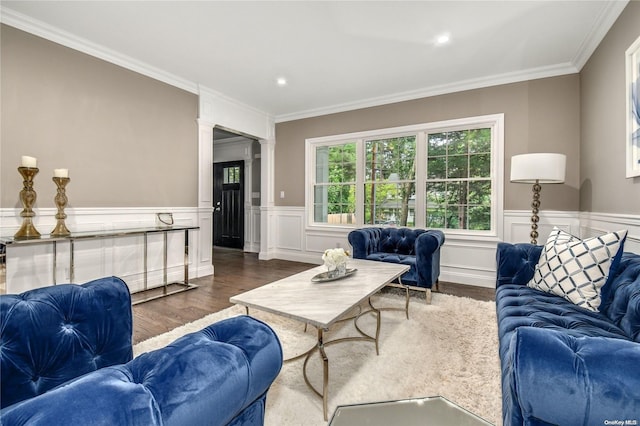 living room with ornamental molding, dark wood-type flooring, and ornate columns