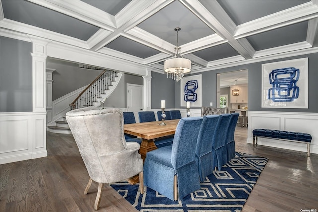 dining space with ornate columns, beamed ceiling, and dark hardwood / wood-style floors