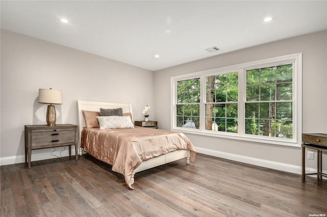 bedroom featuring dark hardwood / wood-style flooring