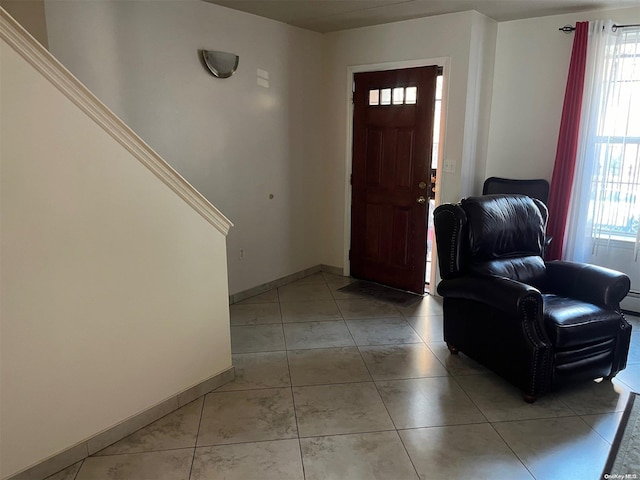 entrance foyer with light tile patterned flooring