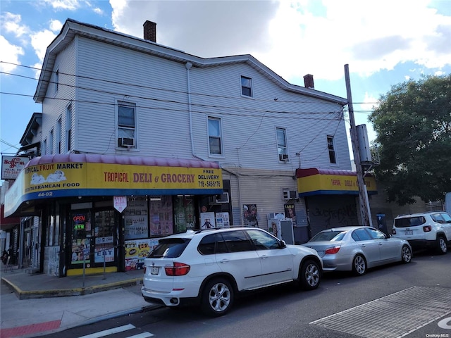 view of building exterior with cooling unit