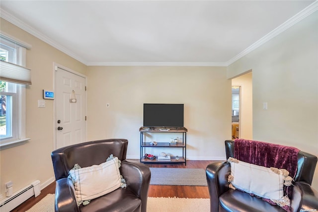 living room with hardwood / wood-style flooring, crown molding, and a baseboard heating unit