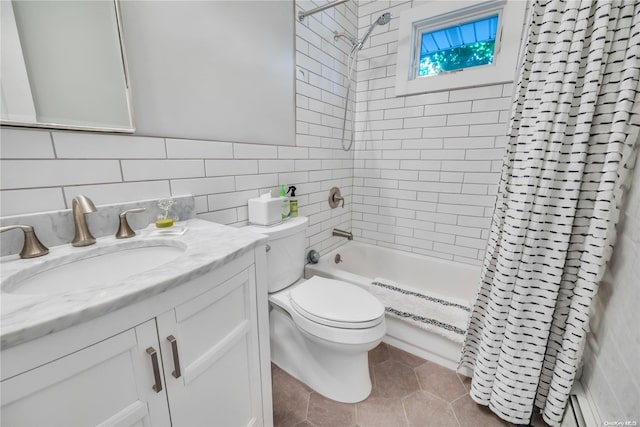 full bathroom with decorative backsplash, tile patterned floors, vanity, a baseboard heating unit, and tile walls