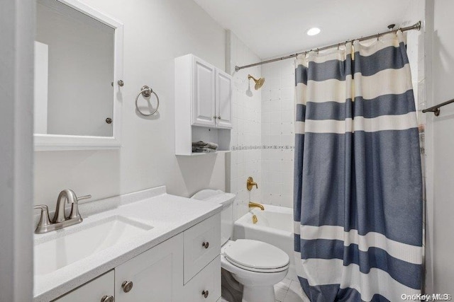 full bathroom with vanity, toilet, and shower / tub combo with curtain