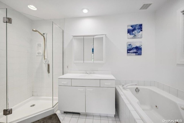 bathroom featuring tile patterned flooring, shower with separate bathtub, and vanity