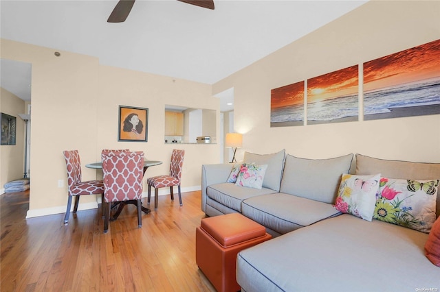 living room featuring hardwood / wood-style flooring and ceiling fan