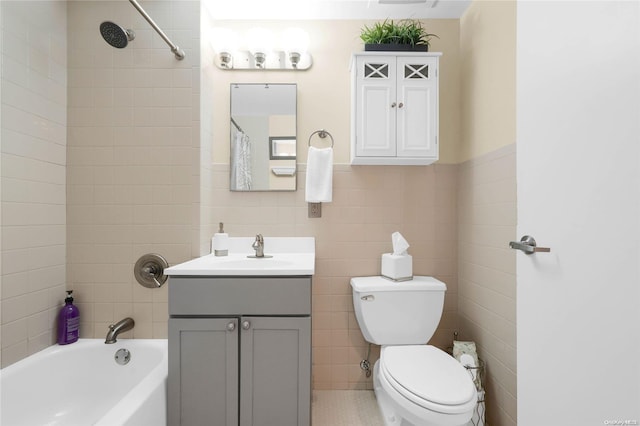 full bathroom featuring shower / bath combo, vanity, tile walls, and toilet