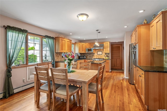 dining space featuring light hardwood / wood-style flooring