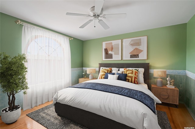 bedroom featuring ceiling fan and hardwood / wood-style flooring