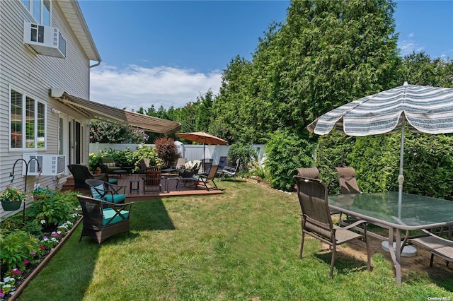 view of yard with a patio area and a wall mounted AC