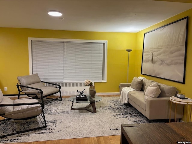 interior space featuring radiator and hardwood / wood-style flooring