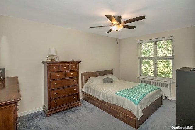 carpeted bedroom with ceiling fan and radiator heating unit