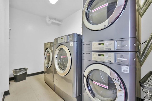 clothes washing area with stacked washer / drying machine