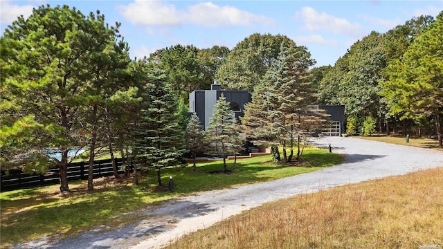 view of home's community featuring a lawn