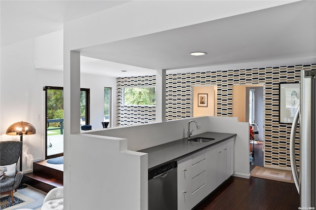 707 Pleasure Dr, Flanders, NY 11901 - kitchen with appliances with stainless steel finishes, dark wood-style flooring, a sink, recessed lighting, and a peninsula