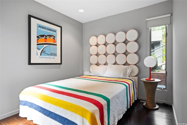 707 Pleasure Dr, Flanders, NY 11901 - bedroom with baseboards and wood finished floors