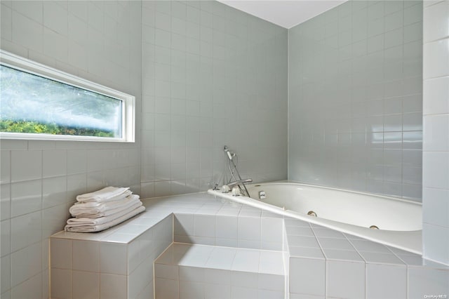 bathroom featuring tiled bath