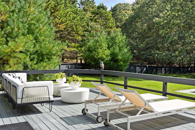 wooden terrace with a lawn