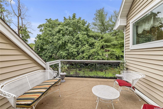 view of patio featuring a balcony