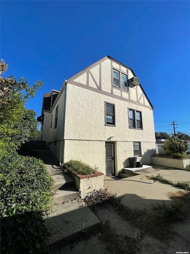 rear view of property featuring a patio