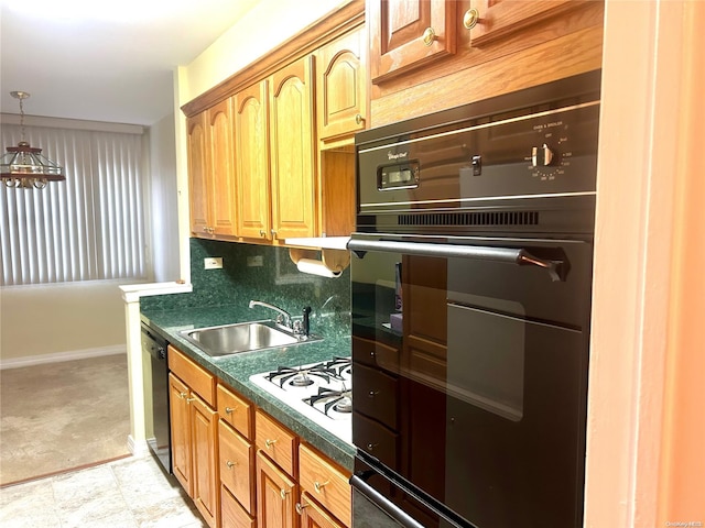 kitchen with black appliances, sink, and tasteful backsplash