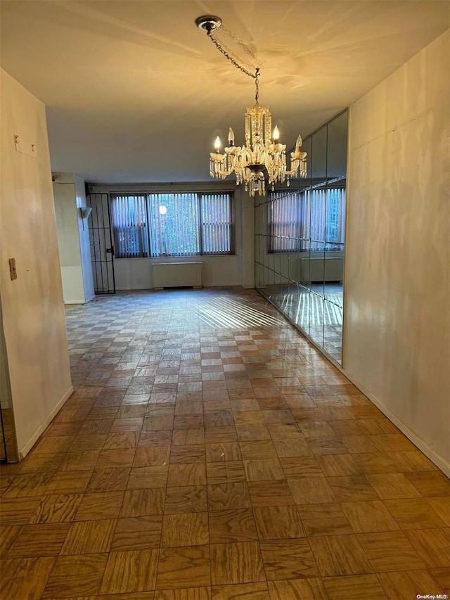 unfurnished dining area with an inviting chandelier