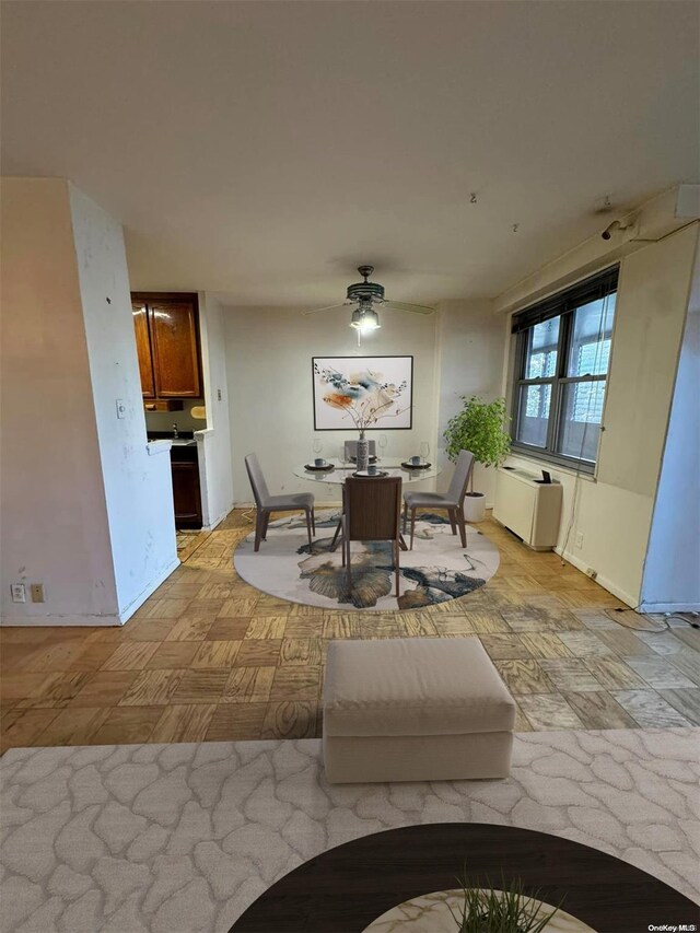 dining area featuring light parquet flooring