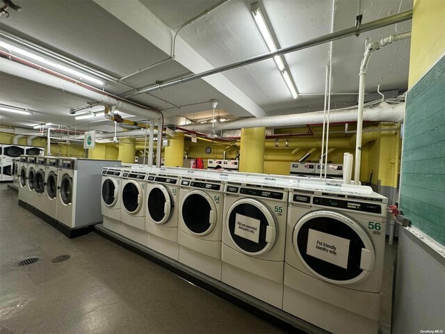 washroom with washing machine and clothes dryer