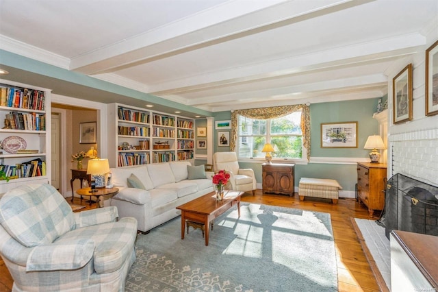 living area with a fireplace, beam ceiling, crown molding, and wood-type flooring