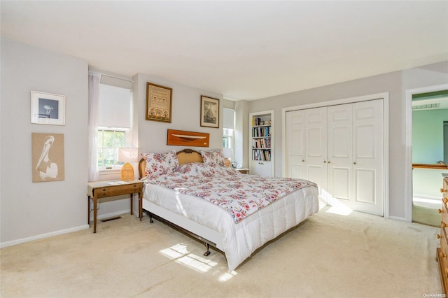 carpeted bedroom with a closet