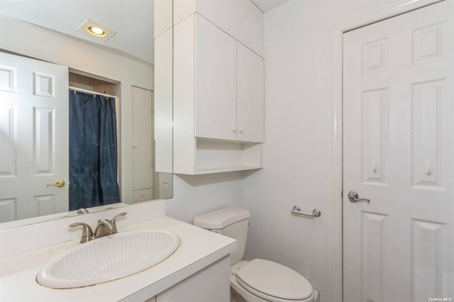 bathroom with vanity and toilet