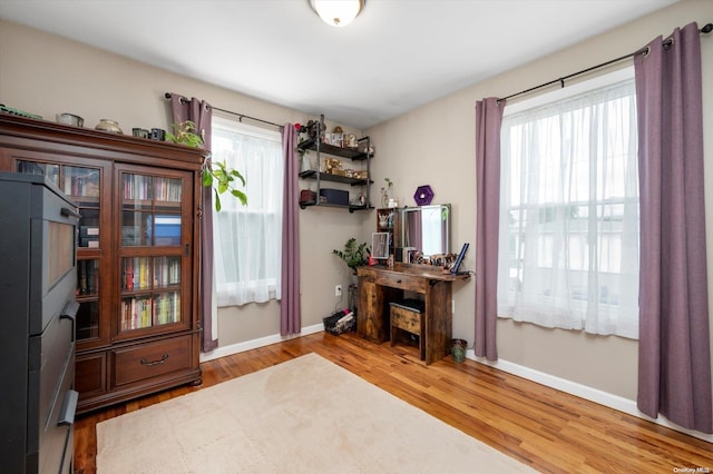 home office with light wood-type flooring