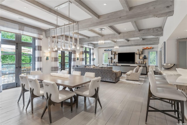 dining room featuring french doors, beamed ceiling, and light wood-type flooring