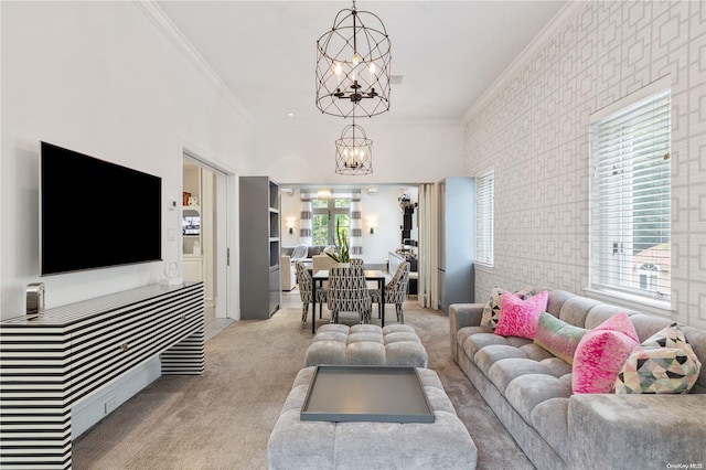 carpeted living room featuring plenty of natural light, a chandelier, and ornamental molding