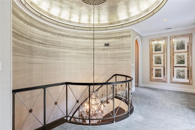 hall featuring crown molding and carpet floors