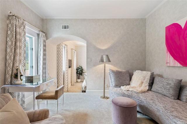 living area featuring carpet flooring and ornamental molding